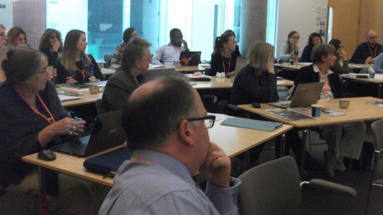 A photograph of conference participants